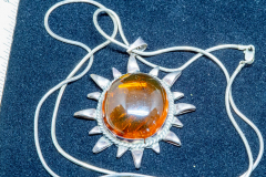 Helen Paddle jewelry silver necklace with sun shaped pendant amber