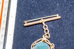 Helen Paddle jewelry gold lapel pin with reversing stone pendant red and green Patti giving back to the estate Helen Paddle jewelry gold lapel pin with reversing stone pendant red and green Patti giving back to the estate